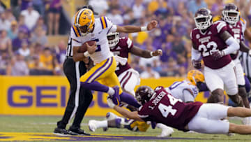 Sep 17, 2022; Baton Rouge, Louisiana, USA; Mississippi State Bulldogs linebacker Jett Johnson (44) tackles LSU Tigers quarterback Jayden Daniels (5) during the first half at Tiger Stadium. Mandatory Credit: Stephen Lew-USA TODAY Sports