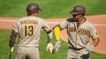 Aug 28, 2022; Kansas City, Missouri, USA; San Diego Padres right fielder Juan Soto (right) celebrates with third baseman Manny Machado (13) after hitting a home run during the seventh inning against the Kansas City Royals at Kauffman Stadium. Mandatory Credit: Jay Biggerstaff-USA TODAY Sports