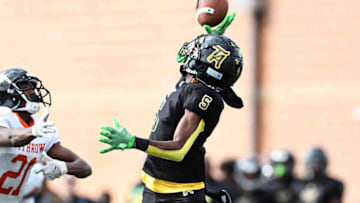 Withrow defensive back Terhyon Nichols breaks up pass against Taft. The Enquirer.