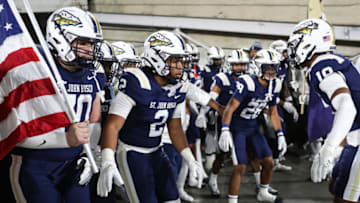 PASADENA, CALIFORNIA - NOVEMBER 25: The St. John Bosco Braves prepare to run onto the field for the championship game against the Mater Dei Monarchs during the 2022 CIF-SS-Ford Division 1 Football Championship at Rose Bowl Stadium on November 25, 2022 in Pasadena, California. (Photo by Meg Oliphant/Getty Images)