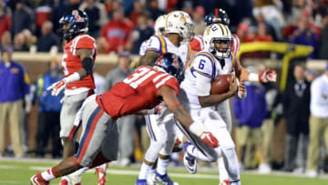 Nov 21, 2015; Oxford, MS, USA; Mississippi Rebels linebacker DeMarquis Gates (31) attempts to tackle LSU Tigers quarterback Brandon Harris (6) during the fourth quarter of the game at Vaught-Hemingway Stadium. Mississippi won 38-17. Mandatory Credit: Matt Bush-USA TODAY Sports