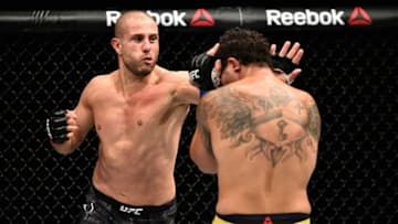 SAITAMA, JAPAN - SEPTEMBER 22: (L-R) Gokhan Saki of Netherlands punches Henrique da Silva of Brazil in their light heavyweight bout during the UFC Fight Night event inside the Saitama Super Arena on September 22, 2017 in Saitama, Japan. (Photo by Jeff Bottari/Zuffa LLC/Zuffa LLC via Getty Images)