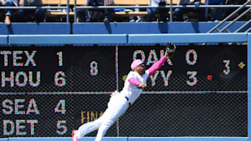 LOS ANGELES, CA - MAY 13: Matt Kemp #27 of the Los Angeles Dodgers makes a diving catch off a hit by Joey Votto #19 of the Cincinnati Reds in the third inning of the game at Dodger Stadium on May 13, 2018 in Los Angeles, California. (Photo by Jayne Kamin-Oncea/Getty Images)