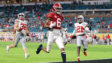 MIAMI GARDENS, FLORIDA - JANUARY 11: DeVonta Smith #6 of the Alabama Crimson Tide rushes for a 42 yard touchdown during the second quarter of the College Football Playoff National Championship game against the Ohio State Buckeyes at Hard Rock Stadium on January 11, 2021 in Miami Gardens, Florida. (Photo by Kevin C. Cox/Getty Images)