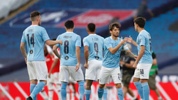 LONDON, ENGLAND - JULY 18: David Silva and Eric Garcia of Manchester City shake hands prior to the FA Cup Semi Final match between Arsenal and Manchester City at Wembley Stadium on July 18, 2020 in London, England. Football Stadiums around Europe remain empty due to the Coronavirus Pandemic as Government social distancing laws prohibit fans inside venues resulting in all fixtures being played behind closed doors. (Photo by Matthew Childs/Pool via Getty Images)