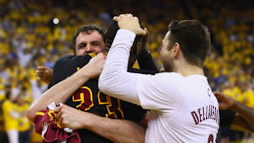 OAKLAND, CA - JUNE 19: LeBron James #23, Kevin Love #0, and Matthew Dellavedova #8 of the Cleveland Cavaliers celebrate after defeating the Golden State Warriors 93-89 in Game 7 of the 2016 NBA Finals at ORACLE Arena on June 19, 2016 in Oakland, California. NOTE TO USER: User expressly acknowledges and agrees that, by downloading and or using this photograph, User is consenting to the terms and conditions of the Getty Images License Agreement. (Photo by Ezra Shaw/Getty Images)