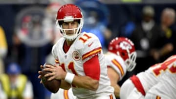 Jan 9, 2016; Houston, TX, USA; Kansas City Chiefs quarterback Alex Smith (11) throws a pass against the Houston Texans during the first quarter in a AFC Wild Card playoff football game at NRG Stadium. Mandatory Credit: John David Mercer-USA TODAY Sports