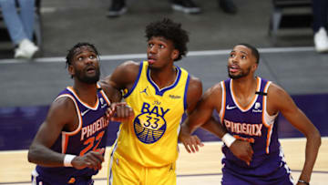 Suns center Deandre Ayton (22) and forward Mikal Bridges (25) against the Warriors center James Wiseman (33): Mark J. Rebilas-USA TODAY Sports