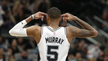 SAN ANTONIO, TX - MARCH 16: Dejounte Murray #5 of the San Antonio Spurs reacts after one of his teammates committed a foul on a Oklahoma City Thunder player in the second half at AT&T Center on March 16, 2022 in San Antonio, Texas. NOTE TO USER: User expressly acknowledges and agrees that, by downloading and or using this photograph, User is consenting to terms and conditions of the Getty Images License Agreement. (Photo by Ronald Cortes/Getty Images)