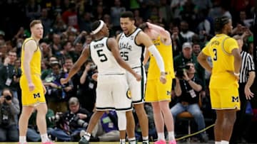 CHICAGO, ILLINOIS - MARCH 17: Cassius Winston #5 and Kenny Goins #25 of the Michigan State Spartans celebrate in the second half against the Michigan Wolverines during the championship game of the Big Ten Basketball Tournament at the United Center on March 17, 2019 in Chicago, Illinois. (Photo by Dylan Buell/Getty Images)
