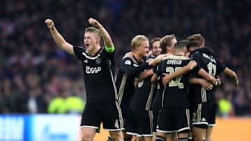 AMSTERDAM, NETHERLANDS - OCTOBER 23: Noussair Mazraoui of Ajax celebrates with teammates after scoring his team's first goal during the Group E match of the UEFA Champions League between Ajax and SL Benfica at Johan Cruyff Arena on October 23, 2018 in Amsterdam, Netherlands. (Photo by Dean Mouhtaropoulos/Getty Images)