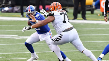 CINCINNATI, OHIO - NOVEMBER 29: Colt McCoy #12 of the New York Giants avoids a sack from Xavier Williams #71 of the Cincinnati Bengals during the second half at Paul Brown Stadium on November 29, 2020 in Cincinnati, Ohio. (Photo by Jamie Sabau/Getty Images)
