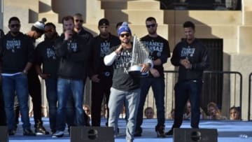 Christian Colon holds World Series Trophy - Mandatory Credit: Denny Medley-USA TODAY Sports