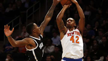 Oct 8, 2016; New York, NY, USA; New York Knicks forward Lance Thomas (42) shoots over Brooklyn Nets guard Rondae Hollis-Jefferson (24) during the first half at Madison Square Garden. Mandatory Credit: Adam Hunger-USA TODAY Sports
