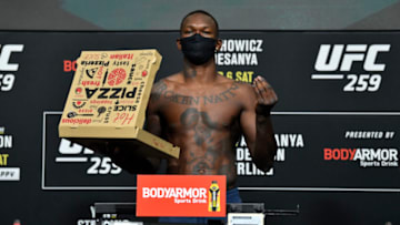 LAS VEGAS, NEVADA - MARCH 05: In this UFC handout, Israel Adesanya of Nigeria poses on the scale during the UFC 259 weigh-in at UFC APEX on March 05, 2021 in Las Vegas, Nevada. (Photo by Jeff Bottari/Zuffa LLC)