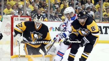 Apr 13, 2016; Pittsburgh, PA, USA; Pittsburgh Penguins goalie Jeff Zatkoff (37) makes a save as Pens right wing Phil Kessel (81) defends New York Rangers defenseman Marc Staal (18) during the third period in game one of the first round of the 2016 Stanley Cup Playoffs at the CONSOL Energy Center. The Penguins won 5-2. Mandatory Credit: Charles LeClaire-USA TODAY Sports