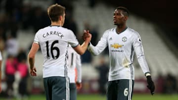 STRATFORD, ENGLAND - JANUARY 02: Michael Carrick of Manchester United and Paul Pogba of Manchester United during the Premier League match between West Ham United and Manchester United at London Stadium on January 2, 2017 in Stratford, England. (Photo by Catherine Ivill - AMA/Getty Images)