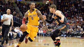 Apr 11, 2016; Cleveland, OH, USA; Cleveland Cavaliers guard J.R. Smith (5) drives on Atlanta Hawks guard Kyle Korver (26) during the first quarter at Quicken Loans Arena. Mandatory Credit: Ken Blaze-USA TODAY Sports