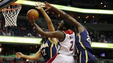 Nov 5, 2014; Washington, DC, USA; Washington Wizards guard John Wall (2) shoots the ball as Indiana Pacers center Ian Mahinmi (28) and Pacers forward Chris Copeland (22) defend in the fourth quarter at Verizon Center. The Wizards won 96-94 in overtime. Mandatory Credit: Geoff Burke-USA TODAY Sports