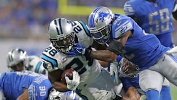 Jonathan Stewart runs for a first down as Tavon Wilson of the Detroit Lions makes the stop during the second quarter of the game against the Detroit Lions at Ford Field on October 8, 2017 in Detroit, Michigan. (Photo by Leon Halip/Getty Images) (Photo by Leon Halip/Getty Images)
