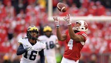 MADISON, WI - NOVEMBER 18: A.J. Taylor #4 of the Wisconsin Badgers catches a pass in front of Jaylen Kelly-Powell #16 of the Michigan Wolverines during the third quarter of a game at Camp Randall Stadium on November 18, 2017 in Madison, Wisconsin. (Photo by Stacy Revere/Getty Images)