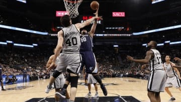 Apr 17, 2016; San Antonio, TX, USA; Memphis Grizzlies power forward Jarell Martin (10) shoots the ball as San Antonio Spurs center Boban Marjanovic (40) defends during the second half in game one of the first round of the NBA Playoffs at AT&T Center. Mandatory Credit: Soobum Im-USA TODAY Sports
