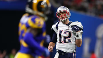 ATLANTA, GEORGIA - FEBRUARY 03: Tom Brady #12 of the New England Patriots walks off the field after throwing an interception in the first quarter during Super Bowl LIII against the Los Angeles Rams at Mercedes-Benz Stadium on February 03, 2019 in Atlanta, Georgia. (Photo by Maddie Meyer/Getty Images)