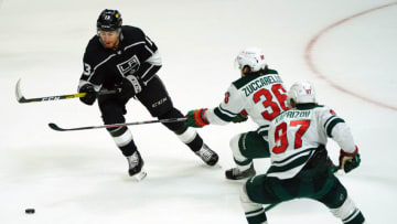 Apr 23, 2021; Los Angeles, California, USA; Los Angeles Kings center Gabriel Vilardi (13) moves the puck against Minnesota Wild right wing Mats Zuccarello (36) and left wing Kirill Kaprizov (97) during the second period at Staples Center. Mandatory Credit: Gary A. Vasquez-USA TODAY Sports