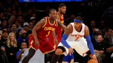 Jan 30, 2014; New York, NY, USA; New York Knicks small forward Carmelo Anthony (7) readies to drive past Cleveland Cavaliers shooting guard Dion Waiters (3) during the first quarter at Madison Square Garden. Mandatory Credit: Anthony Gruppuso-USA TODAY Sports