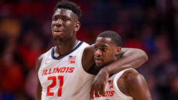 CHAMPAIGN, IL - MARCH 08: Kofi Cockburn #21 of the Illinois Fighting Illini breaks up a scuffle between Da'Monte Williams #20 of the Illinois Fighting Illini and Connor McCaffery #30 of the Iowa Hawkeyes during the game at State Farm Center on March 8, 2020 in Champaign, Illinois. (Photo by Michael Hickey/Getty Images)
