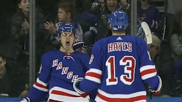 NEW YORK, NEW YORK - DECEMBER 16: Chris Kreider #20 of the New York Rangers celebrates his third period goal against the Vegas Golden Knights and is joined by Kevin Hayes #13 at Madison Square Garden on December 16, 2018 in New York City. The Golden Knights defeated the Rangers 4-3 in overtime. (Photo by Bruce Bennett/Getty Images)