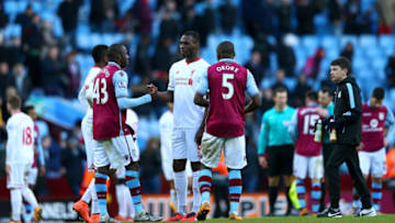 BIRMINGHAM, ENGLAND - FEBRUARY 14: Christian Benteke of Liverpool shakes hands with Aly Cissokho and Jores Okore of Aston Villa after the Barclays Premier League match between Aston Villa and Liverpool at Villa Park on February 14, 2016 in Birmingham, England. (Photo by Michael Steele/Getty Images)