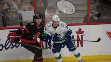 Apr 26, 2021; Ottawa, Ontario, CAN; Ottawa Senators center Chris Tierney (71) battles with Vancouver Canucks left wing Nils Hoglander (36) in the third period at the Canadian Tire Centre. Mandatory Credit: Marc DesRosiers-USA TODAY Sports