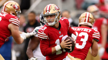 SANTA CLARA, CALIFORNIA - JANUARY 14: Brock Purdy #13 of the San Francisco 49ers scrambles against the Seattle Seahawks during the second quarter in the NFC Wild Card playoff game at Levi's Stadium on January 14, 2023 in Santa Clara, California. (Photo by Ezra Shaw/Getty Images)