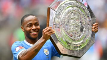 LONDON, ENGLAND - AUGUST 04: Raheem Sterling of Manchester City celebrates with the FA Community Shield following his team's victory in the FA Community Shield match between Liverpool and Manchester City at Wembley Stadium on August 04, 2019 in London, England. (Photo by Clive Mason/Getty Images)
