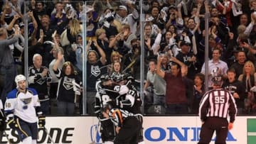 May 10, 2013; Los Angeles, CA, USA; Los Angeles Kings celebrate after left wing Dustin Penner (25) scored in the last seconds in the second period of game six of the first round of the 2013 Stanley Cup Playoffs against the St. Louis Blues at the Staples Center. Mandatory Credit: Jayne Kamin-Oncea-USA TODAY Sports