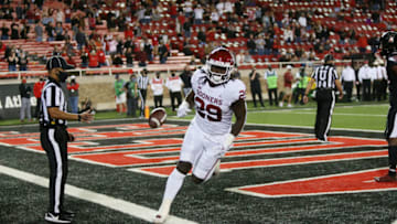 Oct 31, 2020; Lubbock, Texas, USA; Oklahoma Sooners running back Rhamondre Stevenson (29) scores in the first half against the Texas Tech Red Raiders at Jones AT&T Stadium. Mandatory Credit: Michael C. Johnson-USA TODAY Sports