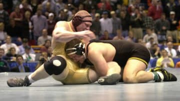 N366242 04: Brock Lesnar of Minnesota, left, fends off Wes Hand of Iowa in their heavyweight championship wrestling match at the 2000 NCAA Wrestling Championships at the Kiel Center, in St. Louis, Mo., March 18, 2000. Lesnar beat Hand 3-2. (Photo by Bill Greenblatt)