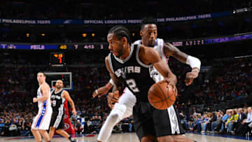 PHILADELPHIA,PA - FEBRUARY 8 : Kawhi Leonard #2 of the San Antonio Spurs drives to the basket against the Philadelphia 76ers at Wells Fargo Center on February 8, 2017 in Philadelphia, Pennsylvania NOTE TO USER: User expressly acknowledges and agrees that, by downloading and/or using this Photograph, user is consenting to the terms and conditions of the Getty Images License Agreement. Mandatory Copyright Notice: Copyright 2016 NBAE (Photo by Jesse D. Garrabrant/NBAE via Getty Images)