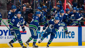Apr 12, 2022; Vancouver, British Columbia, CAN; The Vancouver Canucks bench celebrates the game winning goal scored by defenseman Quinn Hughes (43) against the Vegas Golden Knights in the third period at Rogers Arena. Canucks won 5-4 in overtime. Mandatory Credit: Bob Frid-USA TODAY Sports