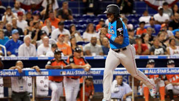 MIAMI, FL - JULY 09: Vladimir Guerrero Jr. #27 of the Toronto Blue Jays and the World Team scores on an RBI single by Josh Naylor #14 of the San Diego Padres and the World Team in the fifth inning against the U.S. Team during the SiriusXM All-Star Futures Game at Marlins Park on July 9, 2017 in Miami, Florida. (Photo by Mike Ehrmann/Getty Images)