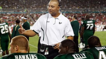 TAMPA, FL - SEPTEMBER 25: Receivers coach Phil McGeoghan (C) of the South Florida Bulls talks with his players on the sideline against the Western Kentucky Hilltoppers during the game at Raymond James Stadium on September 25, 2010 in Tampa, Florida. (Photo by J. Meric/Getty Images)