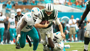 MIAMI GARDENS, FL - OCTOBER 22: Josh McCown #15 of the New York Jets tackled by Jordan Phillips #97 and Terrence Fede #78 of the Miami Dolphins during the third quarter at Hard Rock Stadium on October 22, 2017 in Miami Gardens, Florida. (Photo by Mike Ehrmann/Getty Images)