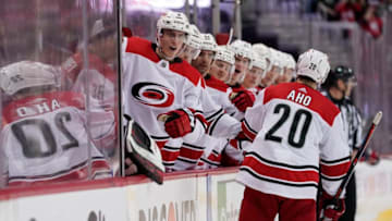 WASHINGTON, DC - APRIL 13: Sebastian Aho #20 of the Carolina Hurricanes celebrates with his teammates after scoring a goal in the second period against the Washington Capitals in Game Two of the Eastern Conference First Round during the 2019 NHL Stanley Cup Playoffs at Capital One Arena on April 13, 2019 in Washington, DC. (Photo by Patrick McDermott/NHLI via Getty Images)