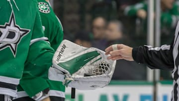 DALLAS, TX - DECEMBER 31: Dallas Stars goaltender Ben Bishop (30) opens his glove for the referee to get the puck during the game between the Dallas Stars and the Montreal Canadiens on December 31, 2018 at the American Airlines Center in Dallas, Texas. (Photo by Matthew Pearce/Icon Sportswire via Getty Images)