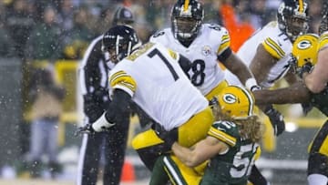 Dec 22, 2013; Green Bay, WI, USA; Green Bay Packers linebacker Clay Matthews (52) sacks Pittsburgh Steelers quarterback Ben Roethlisberger (7) during the second quarter at Lambeau Field. Mandatory Credit: Jeff Hanisch-USA TODAY Sports