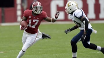 Nov 23, 2013; Tuscaloosa, AL, USA; Alabama Crimson Tide running back Kenyan Drake (17) carries the ball up the field against Chattanooga Mocs defensive back Dee Virgin (19) during the second quarter at Bryant-Denny Stadium. Mandatory Credit: John David Mercer-USA TODAY Sports