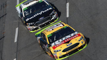 MARTINSVILLE, VA - OCTOBER 28: Clint Bowyer, driver of the #14 Rush Truck Centers Ford, leads Aric Almirola, driver of the #10 Smithfield Ford, during the Monster Energy NASCAR Cup Series First Data 500 at Martinsville Speedway on October 28, 2018 in Martinsville, Virginia. (Photo by Sean Gardner/Getty Images)