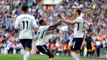 LONDON, ENGLAND - MAY 13: Harry Kane (right) of Tottenham Hotspur celebrates with Kyle Walker-Peters of Tottenham Hotspur as Erik Lamela of Tottenham Hotspur looks on during the Premier League match between Tottenham Hotspur and Leicester City at Wembley Stadium on May 13, 2018 in London, England. (Photo by Henry Browne/Getty Images)