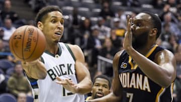 Nov 3, 2016; Milwaukee, WI, USA; Milwaukee Bucks guard Malcolm Brogdon (13) passes the ball away from Indiana Pacers center Al Jefferson (7) in the fourth quarter at BMO Harris Bradley Center. Mandatory Credit: Benny Sieu-USA TODAY Sports